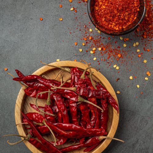 Red chilli paste on a black background.